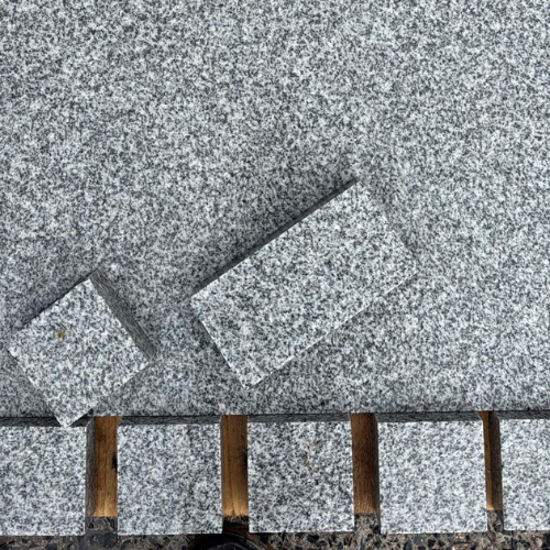 Silver Grey Granite Cobbles - Flame top and Sawn edges